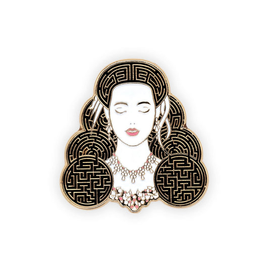 sarah lapel pin. a very clean illustration of sarah, with her eyes closed, and her hair done like in the ballroom scene, with feathers in it. but her hair also has the pattern of a labyrinth in it. pin is gold plated soft enamel.