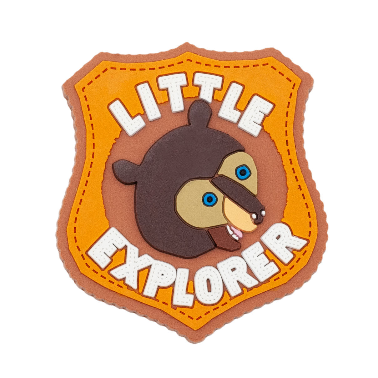Little Explorer magnet made of soft PVC. Bown bear in the center with letter above and below bear. Colors include light brown, orange , dark brown, blue eyes, and white lettering. Lettering says "little explorer"