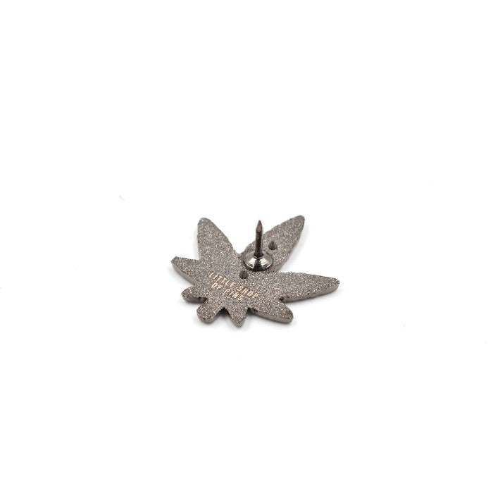 Stoned looking pot leaf in pin form! Back of pin with one post.