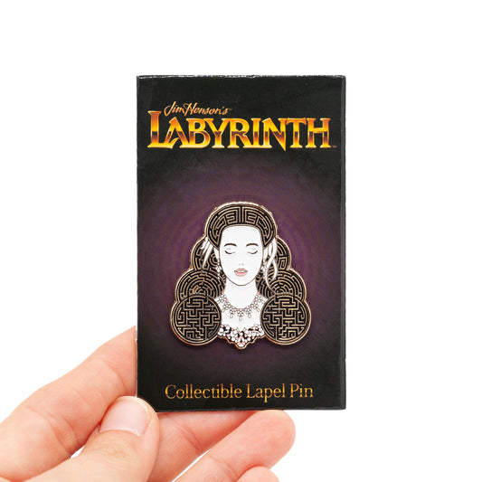 sarah lapel pin on its backing card. the backing card is purple and black with Labyrinth in Gold Lettering. against a white background.