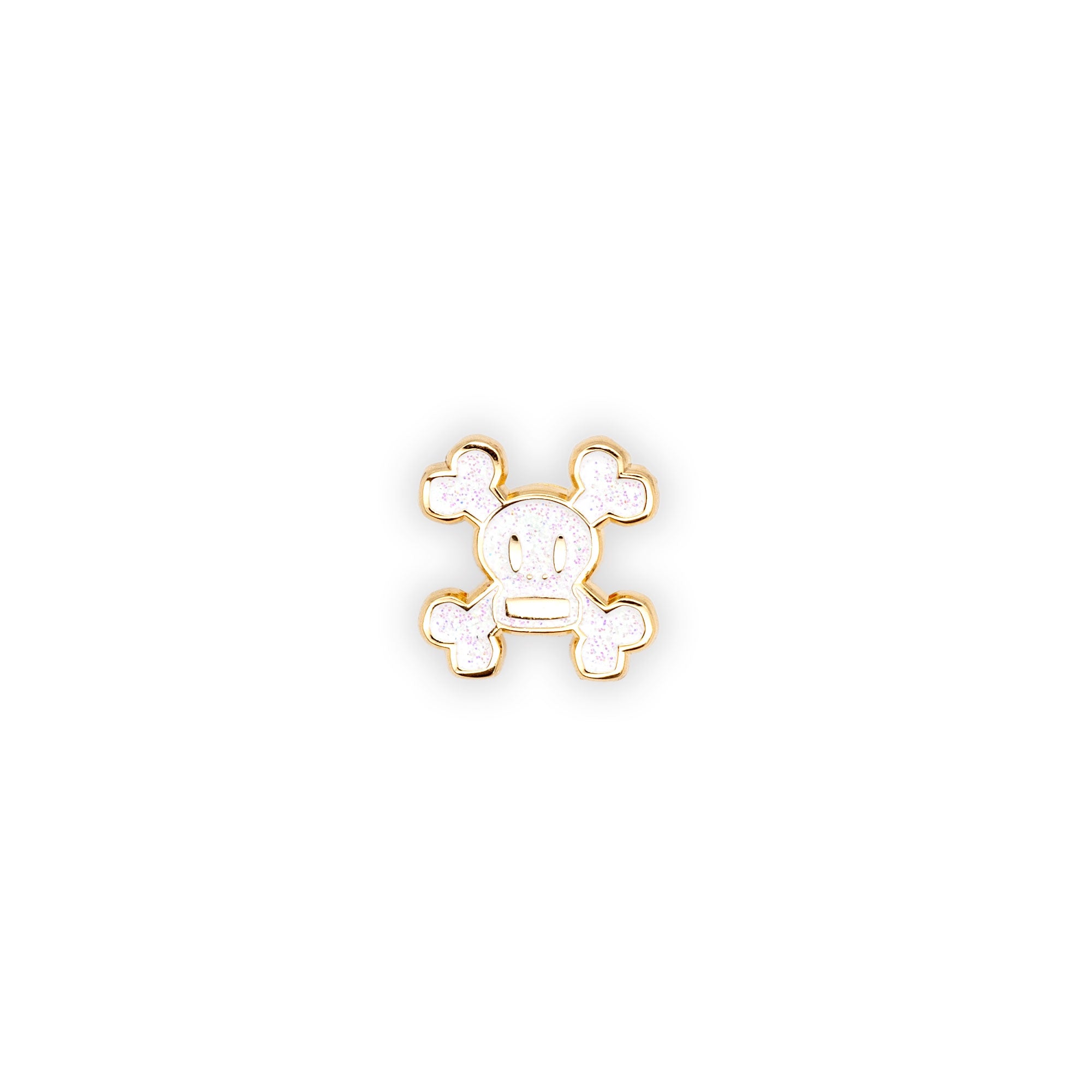 Skurvy limited edition pin is gold plated soft enamel with white glitter fill.  shot on a white background.
