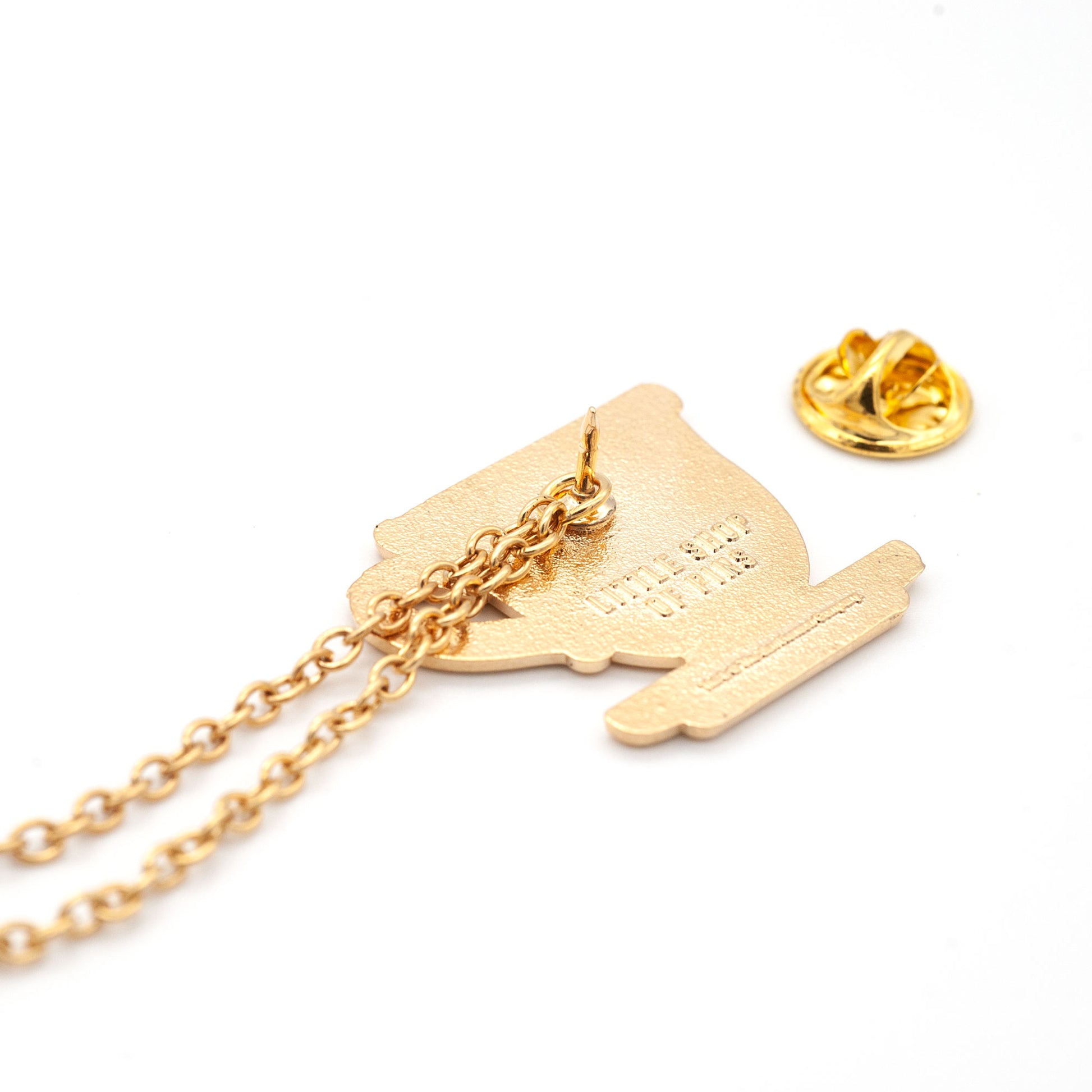 back of teacup pin, showing how the gold chains can attach to the post of the pin. 
